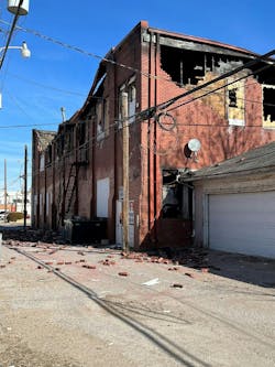 This post-fire view of the Charlie/Delta corner of the VFW building reveals that the brick wall was only one layer in thickness, which indicates that the wall wasn&rsquo;t load-bearing.