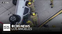 Firefighters rescue driver from overturned truck on 405 Freeway