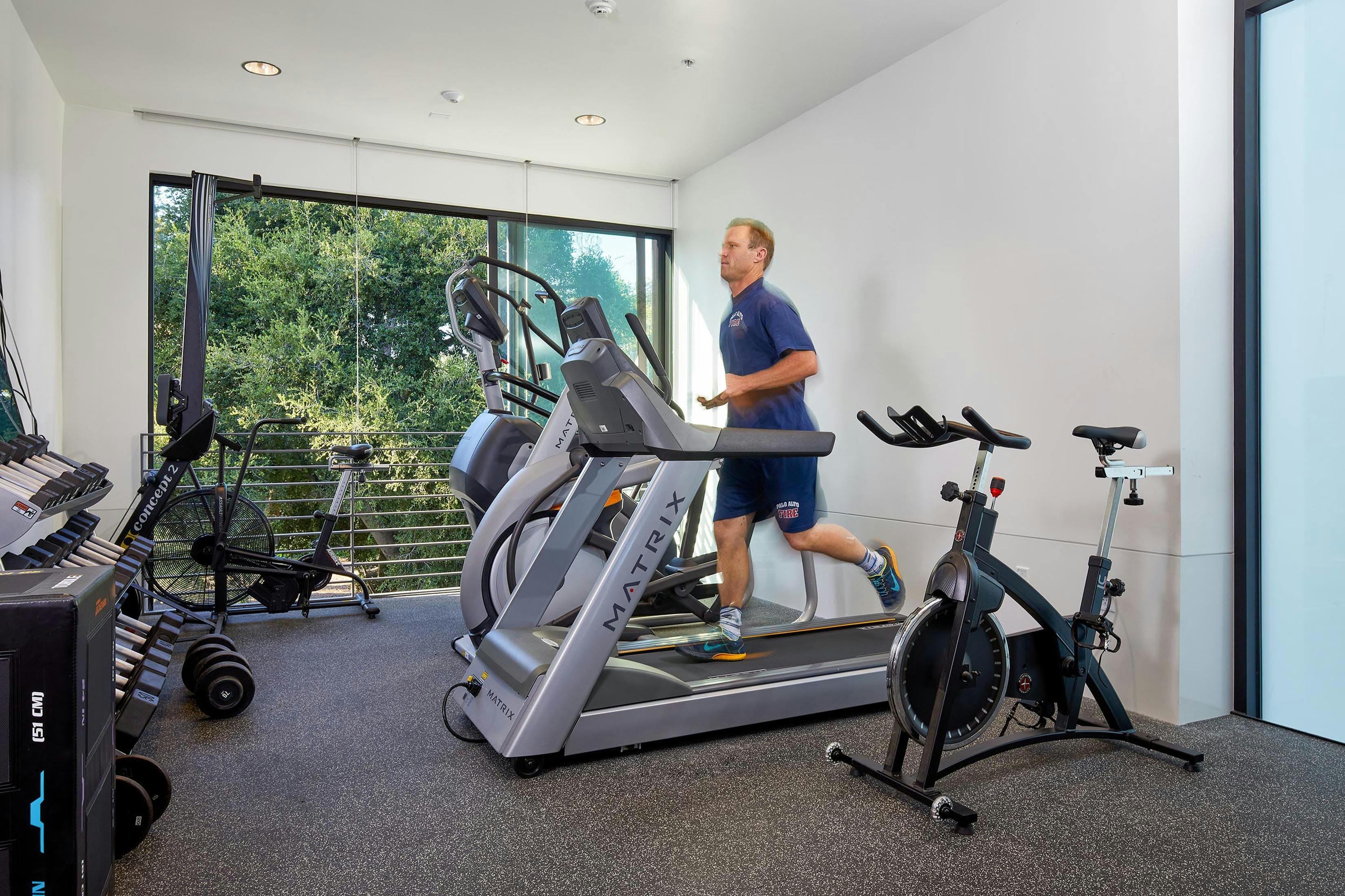 Large windows in fitness rooms, like this one in Palo Alto, CA, Fire Station No. 3, offer safety checks for those working out.