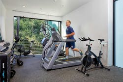 Large windows in fitness rooms, like this one in Palo Alto, CA, Fire Station No. 3, offer safety checks for those working out. Large windows in fitness rooms, like this one in Palo Alto, CA, Fire Station No. 3, offer safety checks for those working out.