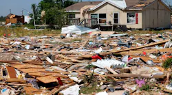 Debris surrounds a home in Valley View, TX, the morning after severe storms moved through Denton and Cooke counties Saturday night.