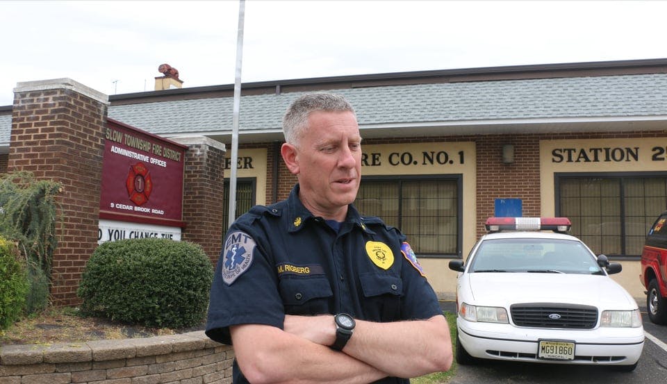 Winslow Township Fire Chief Marc Rigberg standing in front of Cedar Brook Volunteer Fire Company in Sicklerville that closed after 97 years.