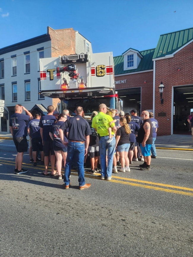 Firefighters and citizens pushed Tower 6 into the station Monday night.