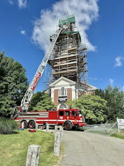 Boston fire officials said the worker fell about 20 feet from the steeple and they used an aerial to bring him 50 down to an ambulance. Boston fire officials said the worker fell about 20 feet from the steeple and they used an aerial to bring him 50 down to an ambulance.