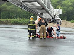 A Stokes basket rig was set up on the Cardiff Volunteer Fire Company’s Tower 15 to hoist the packaged victim out of the mulcher. A Stokes basket rig was set up on the Cardiff Volunteer Fire Company’s Tower 15 to hoist the packaged victim out of the mulcher.