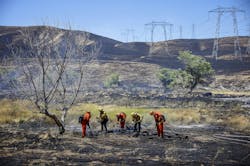 Firefighters work on the Corral Fire in Tracy, CA. Firefighters work on the Corral Fire in Tracy, CA.