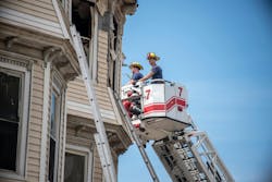 Firefighters working at triple-decker fire. Firefighters working at triple-decker fire.