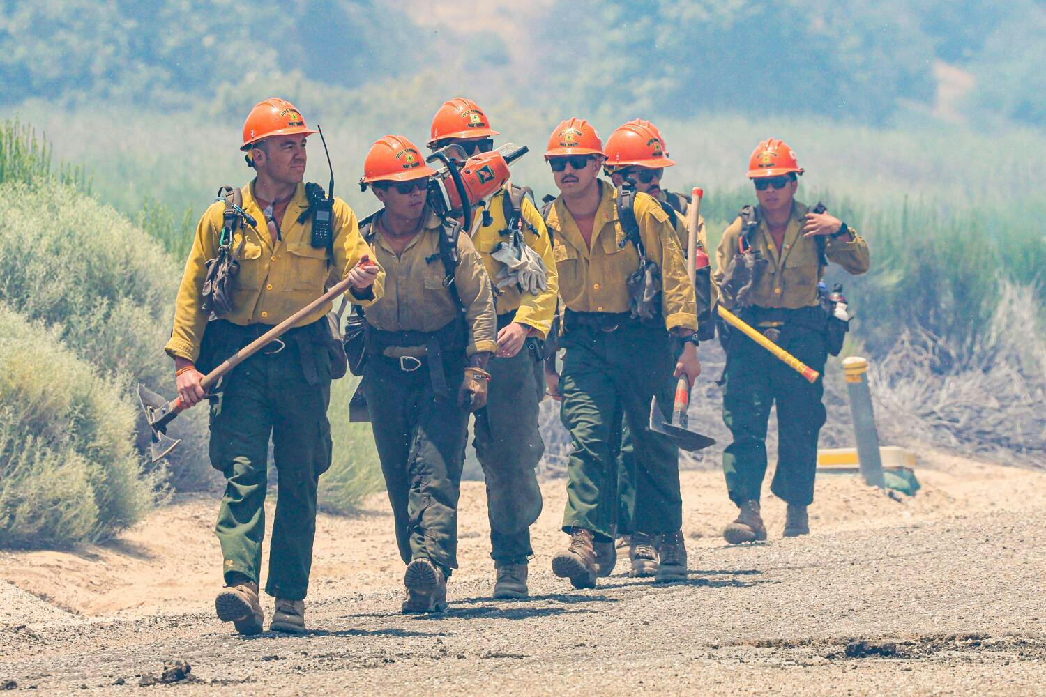 The Little Tujunga Hot Shots hike in to work the Post fire near Pyramid Lake on June 16, 2024.