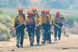 The Little Tujunga Hot Shots hike in to work the Post fire near Pyramid Lake on June 16, 2024.