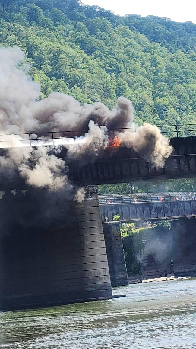 Firefighters from three states were battling a railroad bridge fire between Harpers Ferry, WV and Washington County, MD.