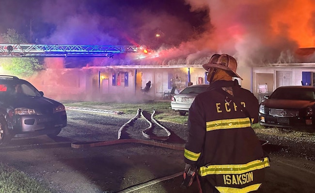 Among the challenges of a fire in a motel that was of a contiguous design that was converted to apartments was its width, which was larger than that of the average multifamily building and contributed to issues of accessing the rear of the building. The aerial ladder provided additional safety for roof operations (even on a one-story building) as well as a high point for a potential rescue.