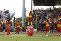 Firefighter Mat Wolf, center, leading the charge during a mid-game dance. Firefighter Mat Wolf, center, leading the charge during a mid-game dance.