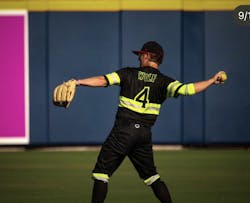 Firefighter and The Firefighters pircher Mat Wolf warming up prior to taking the field. Firefighter and The Firefighters pircher Mat Wolf warming up prior to taking the field.