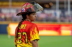 Head coach Valerie Perez locked into the game. Head coach Valerie Perez locked into the game.