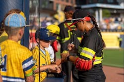 Head coach Valerie Perez signing autographs some Banana Ball fans. Head coach Valerie Perez signing autographs some Banana Ball fans.