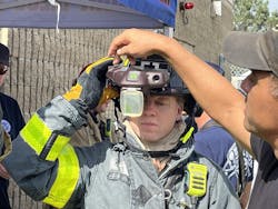 A firefighter receives training on the heads-up display of the C-THRU Navigator during the testing process. A firefighter receives training on the heads-up display of the C-THRU Navigator during the testing process.