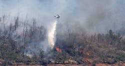 A helicopter drops water over the Thompson Fire near the Oroville Dam on Wednesday. A helicopter drops water over the Thompson Fire near the Oroville Dam on Wednesday.