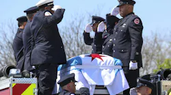 Chicago Firefighter Jermaine Pelt is saluted by colleagues.