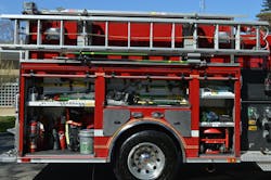 The right-side body compartments on the engines carry forcible entry tools, extinguishers, a positive-pressure ventilation fan, and a complement of ground ladders and hooks on a dropdown ladder rack. Note the location of the wheel-well-mounted cornering light and upper body scene lights. The right-side body compartments on the engines carry forcible entry tools, extinguishers, a positive-pressure ventilation fan, and a complement of ground ladders and hooks on a dropdown ladder rack. Note the location of the wheel-well-mounted cornering light and upper body scene lights.