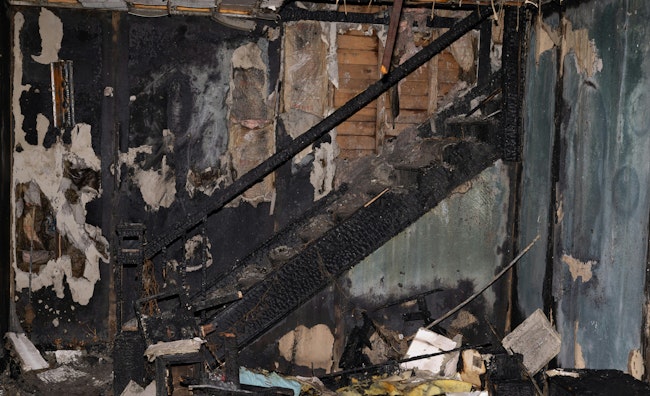 A search of a two-story, fully involved house, which was carried out with the use of a thermal imager, led members to the stairs to the second floor and the location of a trapped occupant on a porch roof. The outcome was a success because of the four-member combination crew’s preparation and training regarding water on fire, including via recently acquired low-pressure hose and nozzles.