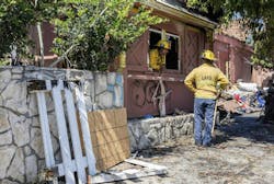 Firefighters overhaul the scene after a fire at the historic Pacific Dining Car restaurant on Saturday, Aug. 3, Firefighters overhaul the scene after a fire at the historic Pacific Dining Car restaurant on Saturday, Aug. 3,
