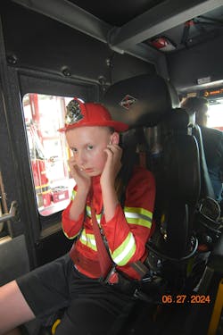 Aldridge prepares for the loud sound of the engine starting up as he gets a ride on the ATFD’s apparatus. Aldridge prepares for the loud sound of the engine starting up as he gets a ride on the ATFD’s apparatus.