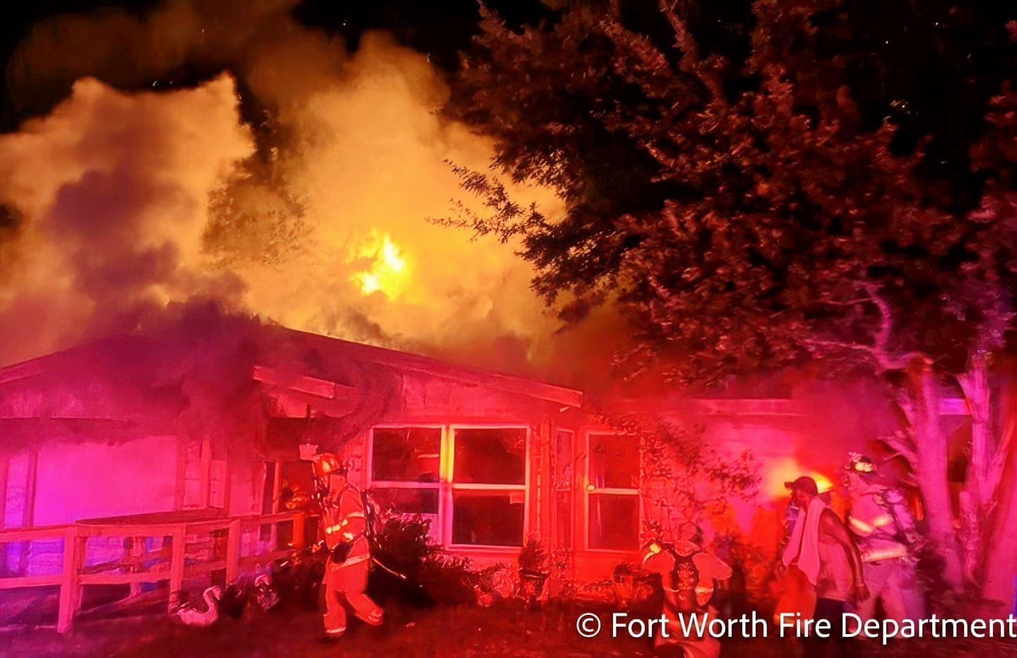 Firefighters found the rear of the Fort Worth home engulfed in flames late Saturday night.