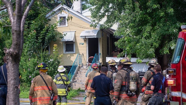 Syracuse firefighters at the scene of one of four house fires.