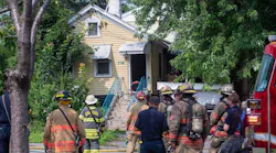 Syracuse firefighters at the scene of one of four house fires.