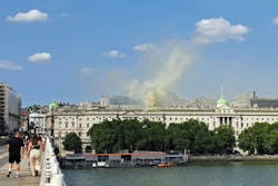 Smoke billows from the roof of Somerset House, beside the River Thames, in London on Saturday. Smoke billows from the roof of Somerset House, beside the River Thames, in London on Saturday.
