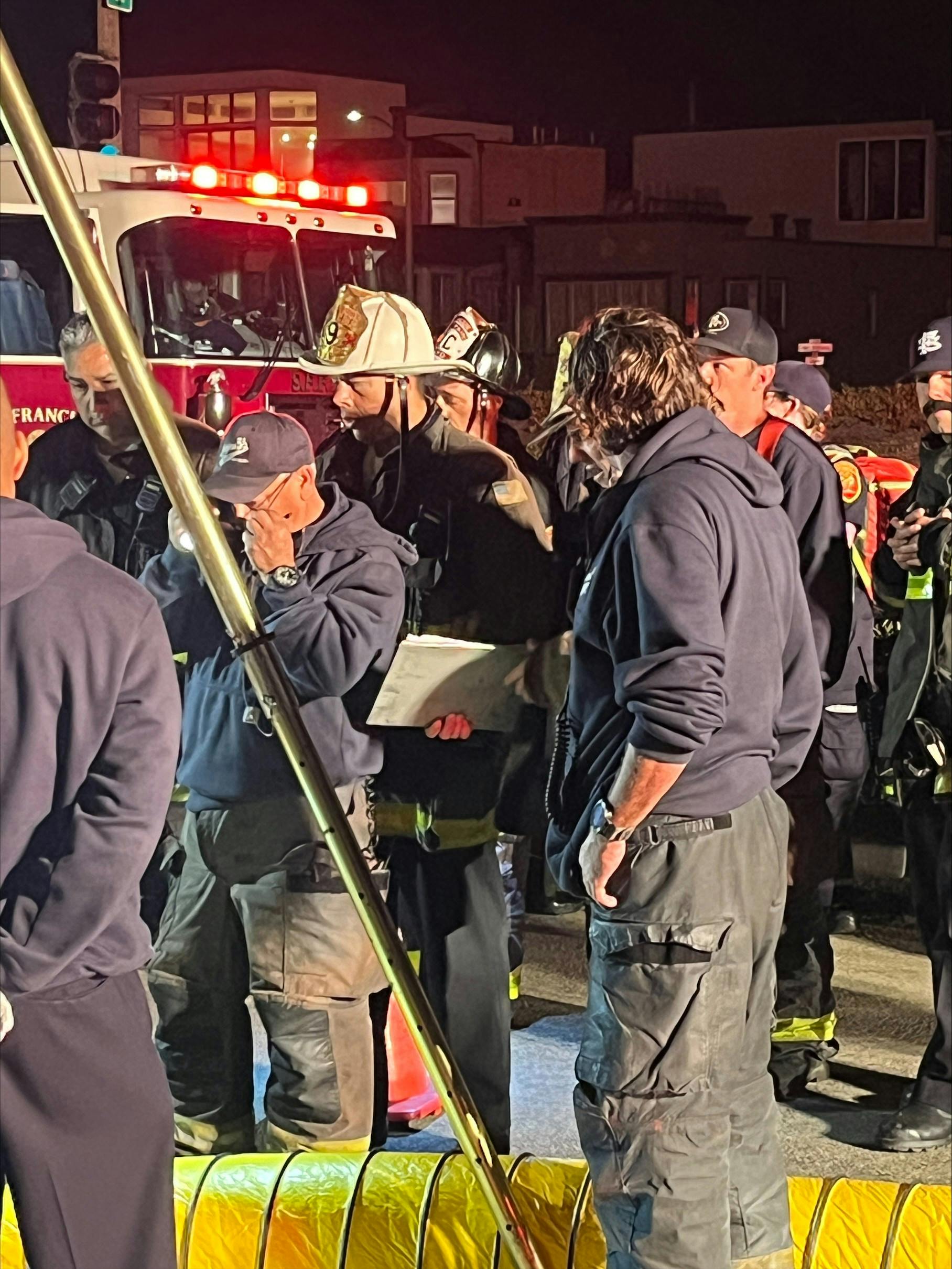 The incident commander holds a safety checklist.