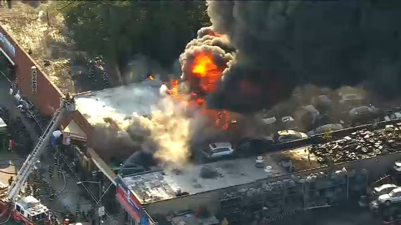 Three-alarm fire breaks out at tire shop in Queens