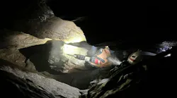A technician uses a chisel during the cave rescue operation.