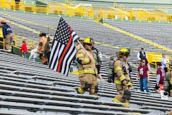 Climbers varied from wearing full turnout gear to masks to carrying flags. Climbers varied from wearing full turnout gear to masks to carrying flags.