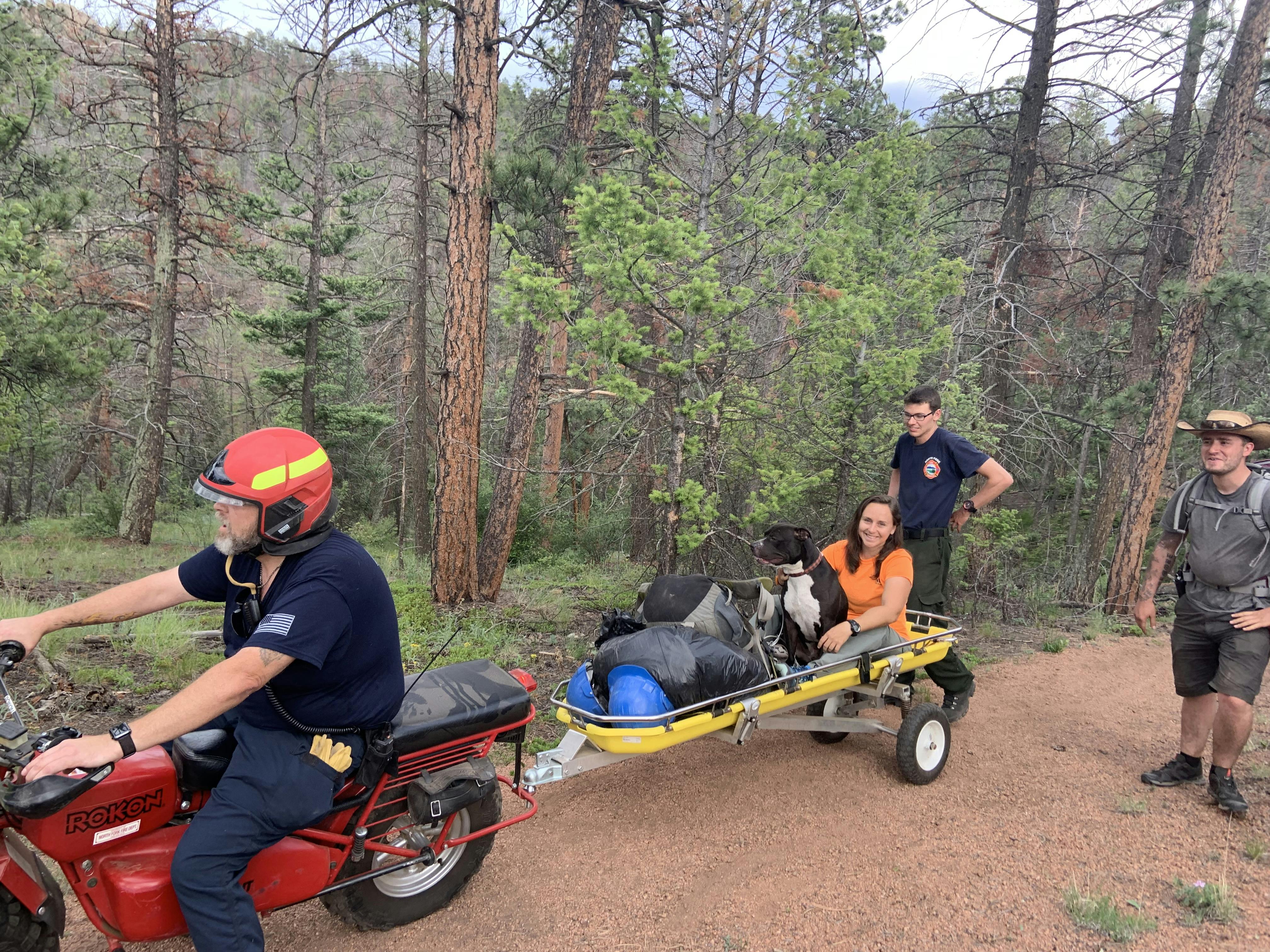 North Fork Volunteer Fire Department (NFVFD) has two two-wheel-drive, low-speed/high-torque, off-road motorcycles to navigate single-track trails for rescues that are far from a road. Here, an injured dog is rescued off of the Colorado Trail.