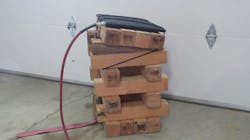 Photo 7: Sloped, lashed crib stack with secured air lifting bag. Photo 7: Sloped, lashed crib stack with secured air lifting bag.