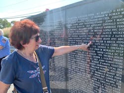 Karen Brock points to the name of Police Officer Walter Brock, her late husband. Karen Brock points to the name of Police Officer Walter Brock, her late husband.