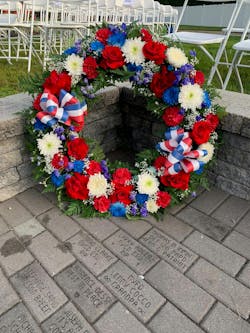 A wreath was placed in the section of the dedicated pavers. A wreath was placed in the section of the dedicated pavers.