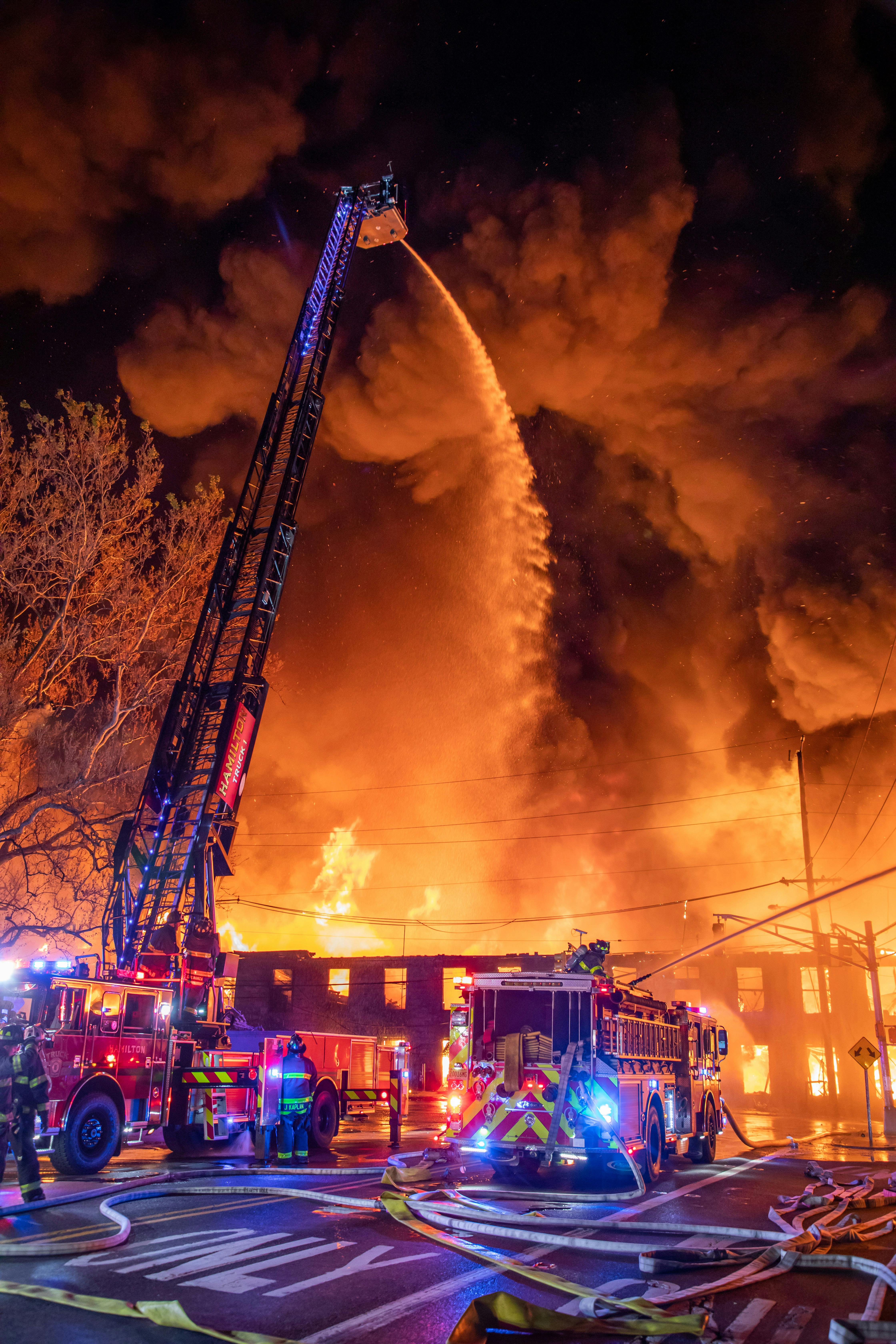 Dispatched at 12:30 a.m., Hamilton Township, NJ, firefighters arrived to find heavy smoke and fire throughout a 170-year-old former rubber manufacturing facility. A defensive operation was ordered, and several additional alarms were transmitted, calling in mutual aid from neighboring towns and elsewhere.
