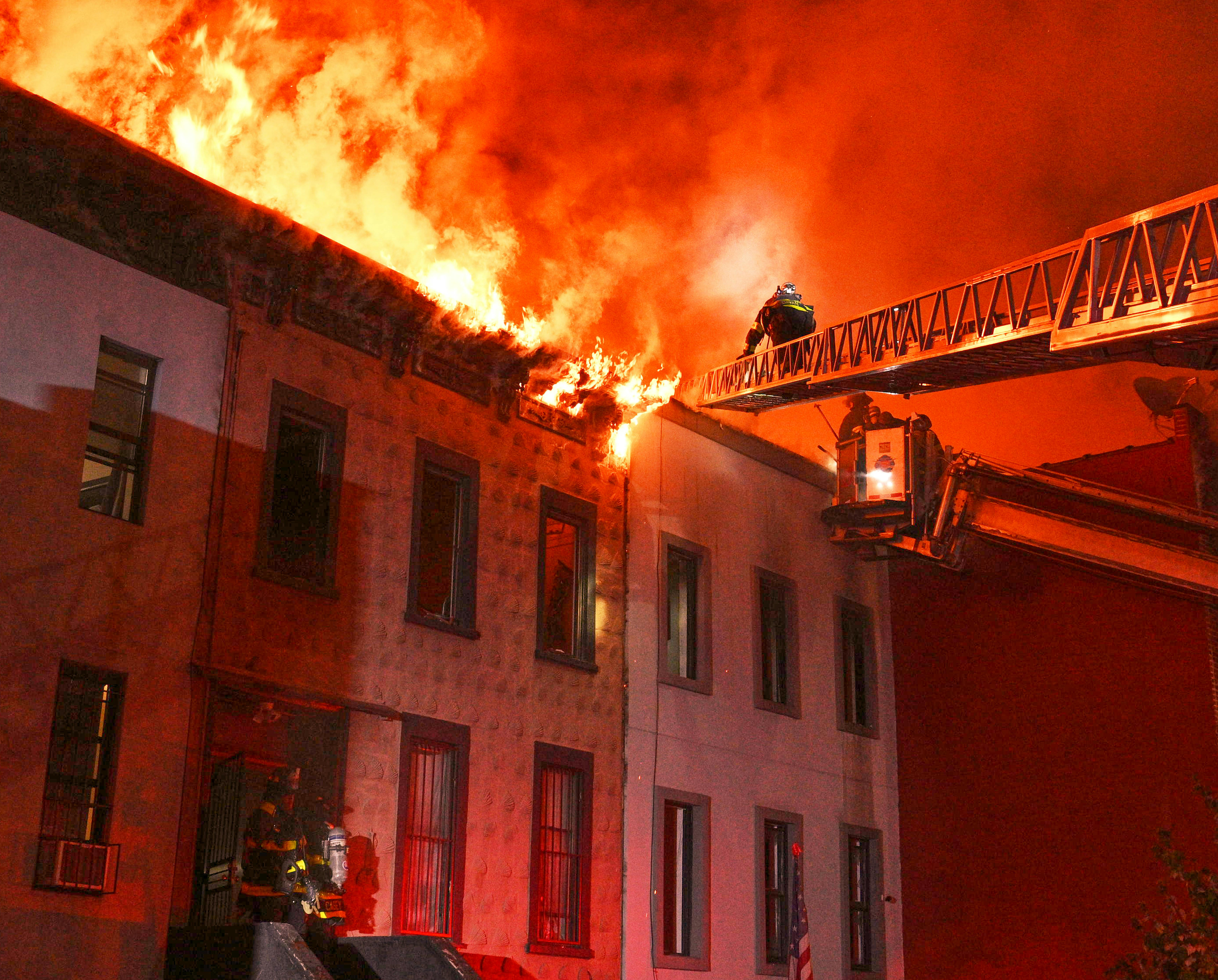 Fifty units and at least 130 members of FDNY battled a four-alarm fire that originated in a three-story apartment building and spread to the apartment buildings that were on each side of the building of origin, ultimately heavily damaging five buildings in total.