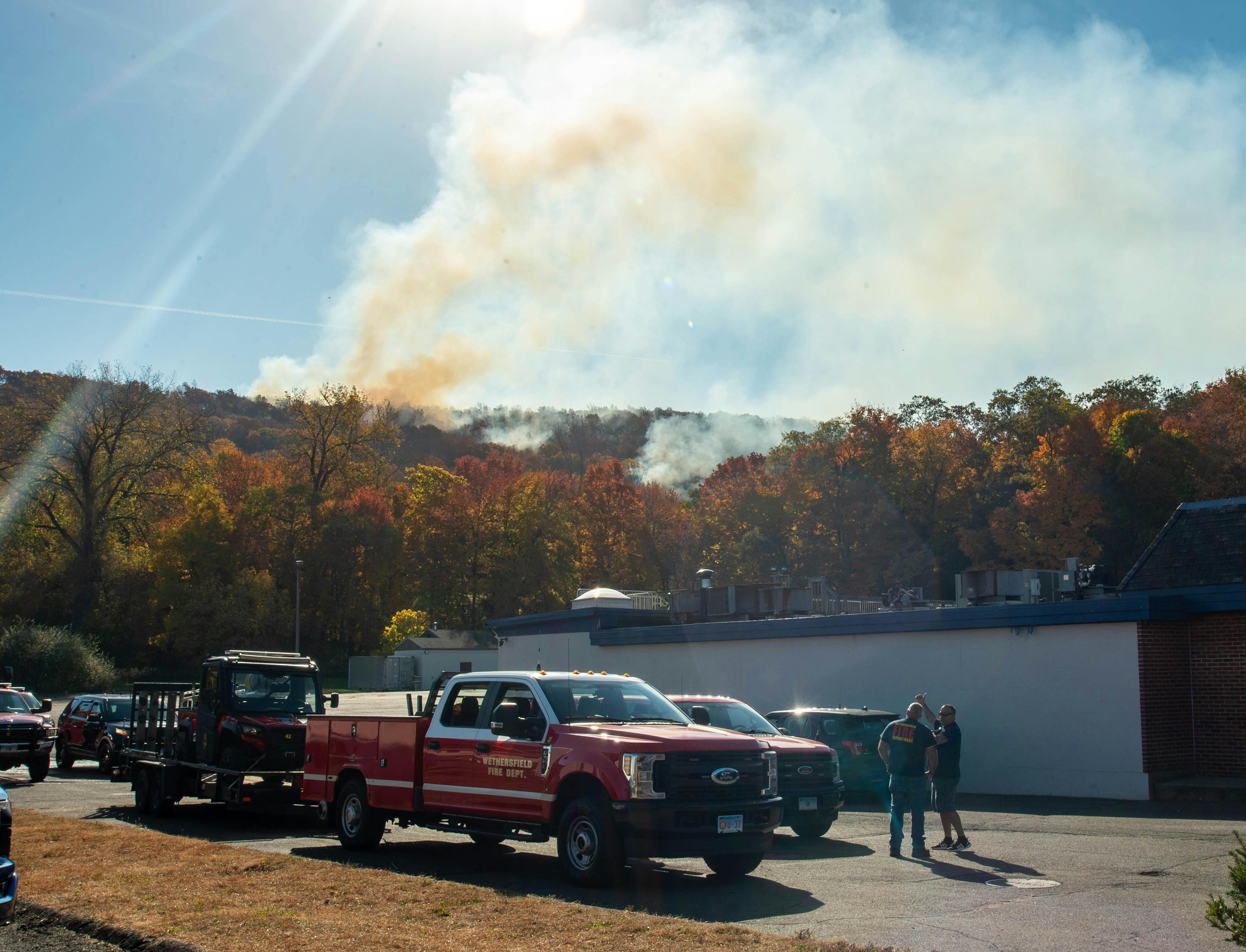 Firefighters gather at a command post near the Berlin wildfire.