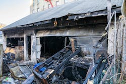 An unidentified man and an unidentified woman, who were living in a Queens garage, were found dead after a fire Saturday morning. An unidentified man and an unidentified woman, who were living in a Queens garage, were found dead after a fire Saturday morning.