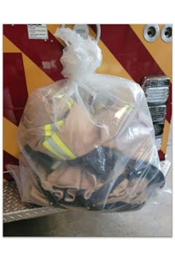 After performing preliminary exposure reduction (gross decontamination), ensure that PPE is properly bagged for safe transport. Use bags that are at least 0.05 mm thick and store them in an exterior compartment while transporting them back to the fire station or cleaning facility. After performing preliminary exposure reduction (gross decontamination), ensure that PPE is properly bagged for safe transport. Use bags that are at least 0.05 mm thick and store them in an exterior compartment while transporting them back to the fire station or cleaning facility.