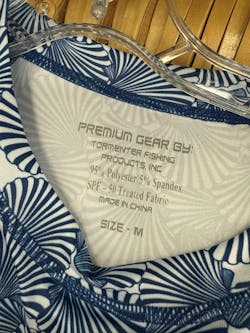 Clothing labels often include the SPF rating of the garment. The higher the rating, the greater the protection. This garment, with a rating of 50, allows only 1/50th of UV radiation to pass through it. Clothing labels often include the SPF rating of the garment. The higher the rating, the greater the protection. This garment, with a rating of 50, allows only 1/50th of UV radiation to pass through it.