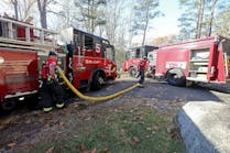 Salem firefighters at a draft site at a recent wildfire. Salem firefighters at a draft site at a recent wildfire.