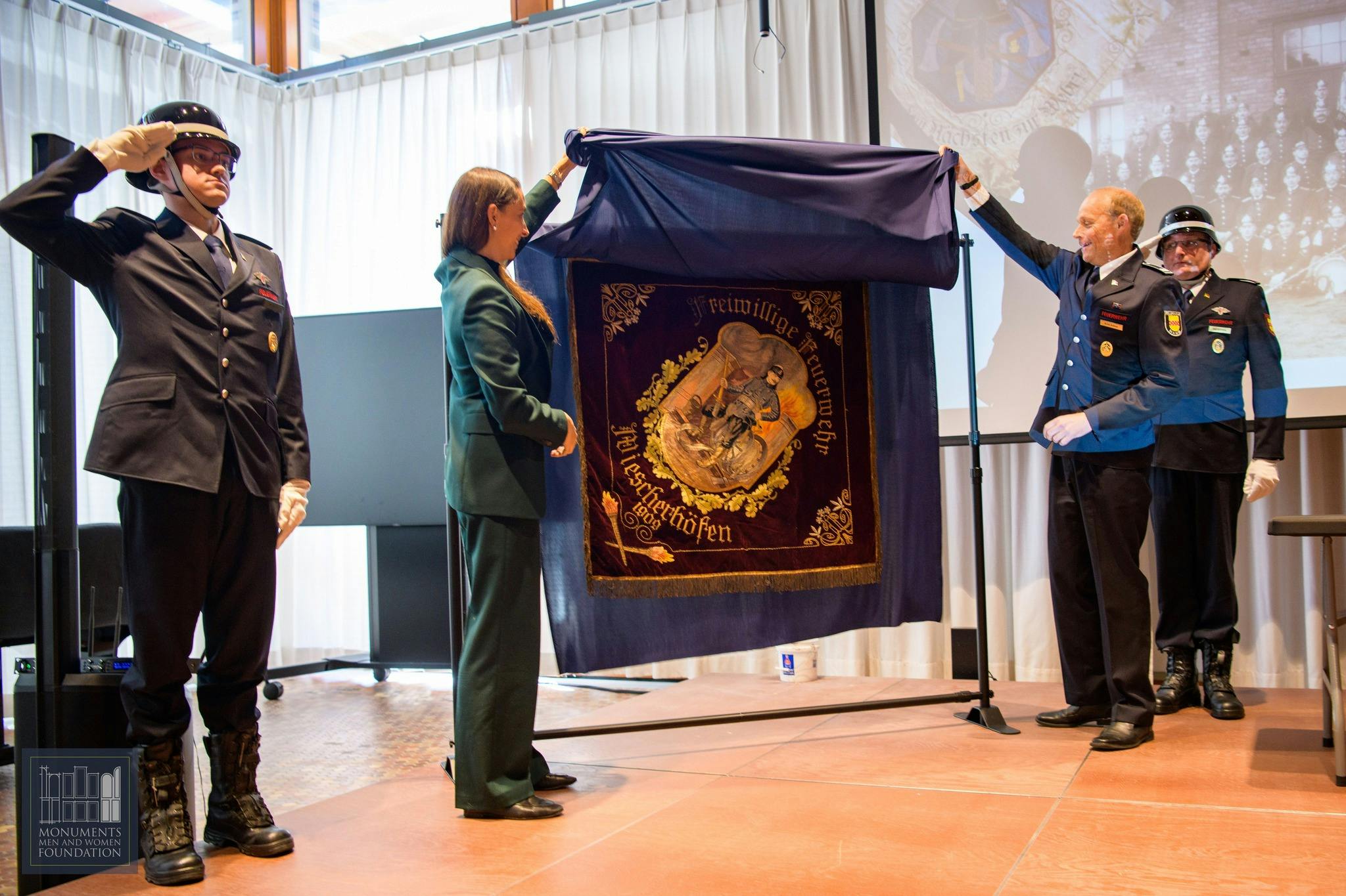 The unveiling of the German fire department flag during the ceremony in Washington, D.C.