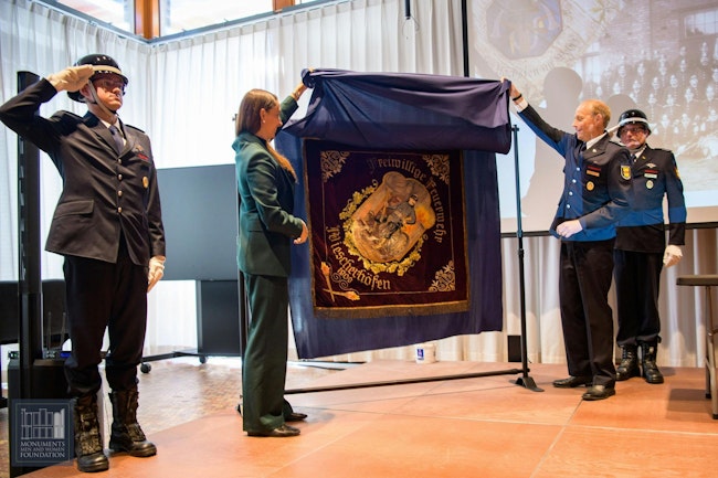 The unveiling of the German fire department flag during the ceremony in Washington, D.C.