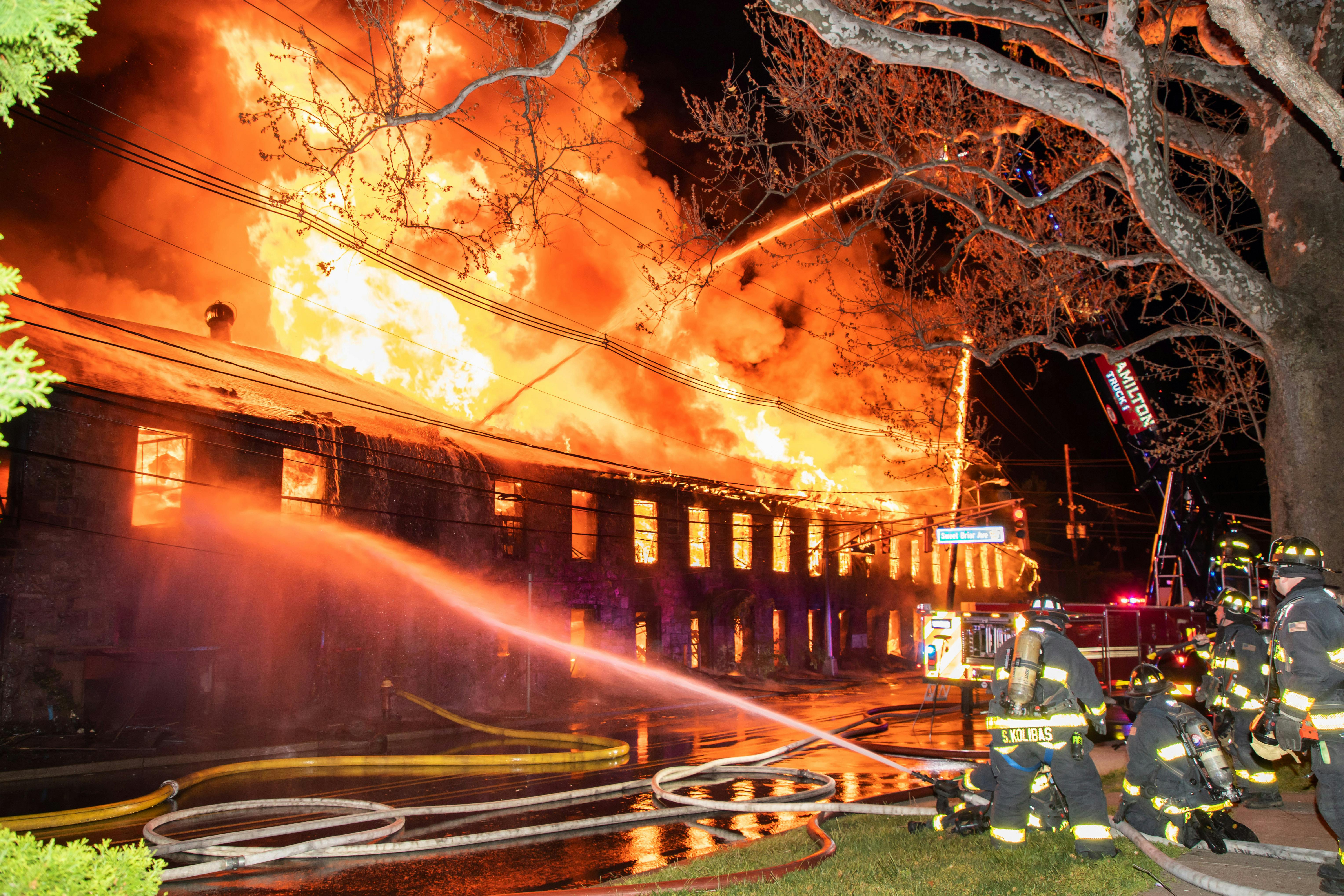 Hamilton Township Fire Department firefighters arrived to find heavy smoke and fire throughout a 170-year-old former rubber factory that was made up of several interconnected buildings.