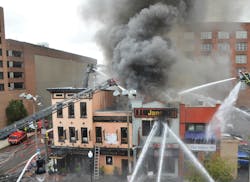 The main fire building, which was a T-shape building that was a half-block long that wrapped around two adjacent buildings, was across the street from Baltimore City Fire Department’s John F. Steadman Memorial Fire Station, but all of the companies from the firehouse were training several blocks away in the subway system when the fire was reported, so their response was delayed. The main fire building, which was a T-shape building that was a half-block long that wrapped around two adjacent buildings, was across the street from Baltimore City Fire Department’s John F. Steadman Memorial Fire Station, but all of the companies from the firehouse were training several blocks away in the subway system when the fire was reported, so their response was delayed.
