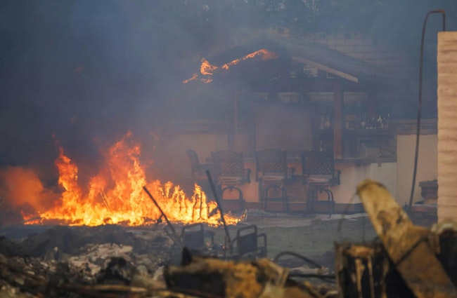 A home burns during one of the 2024 wildfires to burn across California in 2024.